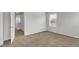 A cozy bedroom with neutral carpet, an open door and plenty of natural light at 209 Weldon, Mcdonough, GA 30253