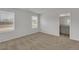 Bright bedroom featuring neutral walls, carpet floors, and windows offering natural light at 209 Weldon, Mcdonough, GA 30253
