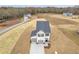Newly built two-story home with attached two-car garage and a spacious front yard at 209 Weldon, Mcdonough, GA 30253