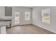 Bright open layout between the kitchen and living space with stainless appliances and granite countertops at 209 Weldon, Mcdonough, GA 30253