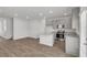 Modern kitchen with gray cabinets, granite countertops, and stainless steel appliances at 209 Weldon, Mcdonough, GA 30253