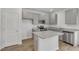 Well-equipped kitchen featuring granite countertops, stainless steel appliances, and gray cabinetry at 209 Weldon, Mcdonough, GA 30253