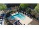 Birds eye view of a neighborhood pool with surrounding umbrellas and lounge seating at 2162 Spikerush Way, Buford, GA 30519
