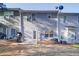 Exterior backyard view of townhome with cement patio and trees at 2162 Spikerush Way, Buford, GA 30519