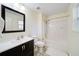 Standard bathroom with a shower and tub combination, dark cabinets, and neutral walls at 2162 Spikerush Way, Buford, GA 30519