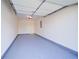 Clean, well-lit garage with epoxy flooring and ample space for parking at 2162 Spikerush Way, Buford, GA 30519