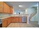 Well-equipped kitchen featuring stainless steel appliances, wooden cabinets, and modern countertops at 2162 Spikerush Way, Buford, GA 30519