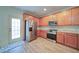 Bright kitchen featuring stainless steel appliances, wooden cabinets, and lots of space at 2162 Spikerush Way, Buford, GA 30519