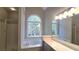 Bright bathroom featuring a glass-door shower, bathtub, and large vanity with a large mirror at 225 Mountain Vista Blvd, Canton, GA 30115