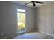 Neutral bedroom features a window with a view of the landscaped yard at 225 Mountain Vista Blvd, Canton, GA 30115