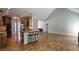 Open floor plan featuring a kitchen with stainless steel appliances, breakfast bar, and hardwood flooring throughout at 225 Mountain Vista Blvd, Canton, GA 30115