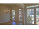 Elegant formal living room featuring hardwood flooring, crown molding, a chandelier and a view to the front yard at 225 Mountain Vista Blvd, Canton, GA 30115