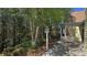 Scenic patio area with a birdhouse and outdoor seating near a lush, wooded landscape at 225 Mountain Vista Blvd, Canton, GA 30115