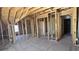 Unfinished room interior featuring exposed framing, offering a customizable space for future living at 225 Mountain Vista Blvd, Canton, GA 30115