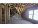 Spacious unfinished room featuring a large window providing ample natural light and exposed construction, ready to be customized at 225 Mountain Vista Blvd, Canton, GA 30115