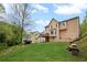 Backyard with lush greenery and mature trees at 3025 Kaley Nw Dr, Kennesaw, GA 30152