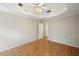 Spacious bedroom with tray ceiling, hardwood floors, and neutral paint scheme, offering an inviting atmosphere at 3025 Kaley Nw Dr, Kennesaw, GA 30152