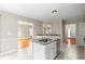 Open kitchen with granite counters, stainless appliances, and view to a spacious living room at 3025 Kaley Nw Dr, Kennesaw, GA 30152