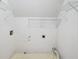 Laundry room features washer and dryer hookups and shelving at 3025 Kaley Nw Dr, Kennesaw, GA 30152