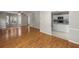 Open floor plan with living room, and adjacent kitchen featuring white cabinets at 3025 Kaley Nw Dr, Kennesaw, GA 30152