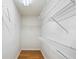 Empty walk-in closet with shelving, offering plenty of storage space and hardwood floors at 3025 Kaley Nw Dr, Kennesaw, GA 30152