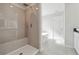 Modern bathroom with a tiled shower, soaking tub, and wood-look tile floors at 358 Orwell Dr, Social Circle, GA 30025