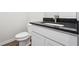 Bathroom featuring a toilet and vanity with a black countertop at 358 Orwell Dr, Social Circle, GA 30025