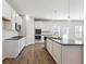 Stylish kitchen with granite island, stainless appliances, lots of counter space and bright lighting at 358 Orwell Dr, Social Circle, GA 30025