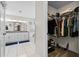 Bathroom view into walk-in closet showing double vanity and soaking tub at 1483 Chamirey Sw Dr, Marietta, GA 30008