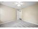 A tan painted bedroom with grey carpet and a doorway is featured at 1483 Chamirey Sw Dr, Marietta, GA 30008