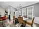 Formal dining area with large windows, modern lighting, neutral paint, and comfortable seating at 1483 Chamirey Sw Dr, Marietta, GA 30008
