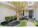 Inviting entrance with a landscaped yard, mulch, and decorative shrubs creating a welcoming feel at 1483 Chamirey Sw Dr, Marietta, GA 30008