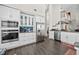 Modern kitchen with stainless steel appliances, white cabinetry, granite countertops, and a spacious layout at 1483 Chamirey Sw Dr, Marietta, GA 30008