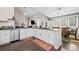 Bright kitchen with updated countertops, white cabinets, stainless steel appliances and an eat-in dining area at 1483 Chamirey Sw Dr, Marietta, GA 30008