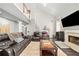 Spacious living room boasts vaulted ceilings, fireplace, and spiral staircase at 1483 Chamirey Sw Dr, Marietta, GA 30008