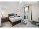 Cozy main bedroom with vaulted ceiling, plush carpet, and large window at 1483 Chamirey Sw Dr, Marietta, GA 30008