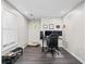 Comfortable office with dark wood floors and large window for natural light at 1483 Chamirey Sw Dr, Marietta, GA 30008