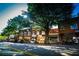 Picturesque street featuring brick buildings, mature trees, and local shops and restaurants at 1483 Chamirey Sw Dr, Marietta, GA 30008