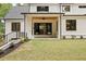 Beautiful backyard with a covered patio, fireplace, and well-manicured lawn at 1501 Harts Mill Ne Rd, Brookhaven, GA 30319