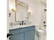 Stylish bathroom featuring a marble countertop, unique mirror, and modern fixtures at 1501 Harts Mill Ne Rd, Brookhaven, GA 30319