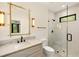Bright bathroom with shower featuring glass doors, marble countertop and unique lighting at 1501 Harts Mill Ne Rd, Brookhaven, GA 30319