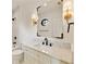 Stylish bathroom with modern fixtures, a unique mirror, and elegant vanity at 1501 Harts Mill Ne Rd, Brookhaven, GA 30319