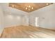 Spacious bedroom featuring tray ceiling, hardwood floors, elegant lighting and plenty of closet space at 1501 Harts Mill Ne Rd, Brookhaven, GA 30319