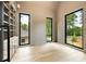 Bright bonus room featuring hardwood floors and three large windows overlooking the landscaped outdoors at 1501 Harts Mill Ne Rd, Brookhaven, GA 30319