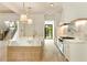 Bright kitchen features a large island with marble countertop and modern appliances at 1501 Harts Mill Ne Rd, Brookhaven, GA 30319