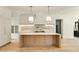 Open kitchen featuring a large island with a marble countertop and stainless steel appliances at 1501 Harts Mill Ne Rd, Brookhaven, GA 30319