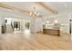 Expansive living space featuring an open floor plan, herringbone floors, modern kitchen, and staircase at 1501 Harts Mill Ne Rd, Brookhaven, GA 30319