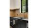 Mudroom features a dark sink with gold plumbing fixtures at 1501 Harts Mill Ne Rd, Brookhaven, GA 30319