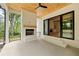 Covered patio with a brick fireplace, wood ceiling, and sliding doors to the interior at 1501 Harts Mill Ne Rd, Brookhaven, GA 30319