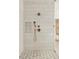 Modern shower featuring elegant tilework, rainfall showerhead, and bronze fixtures at 1501 Harts Mill Ne Rd, Brookhaven, GA 30319
